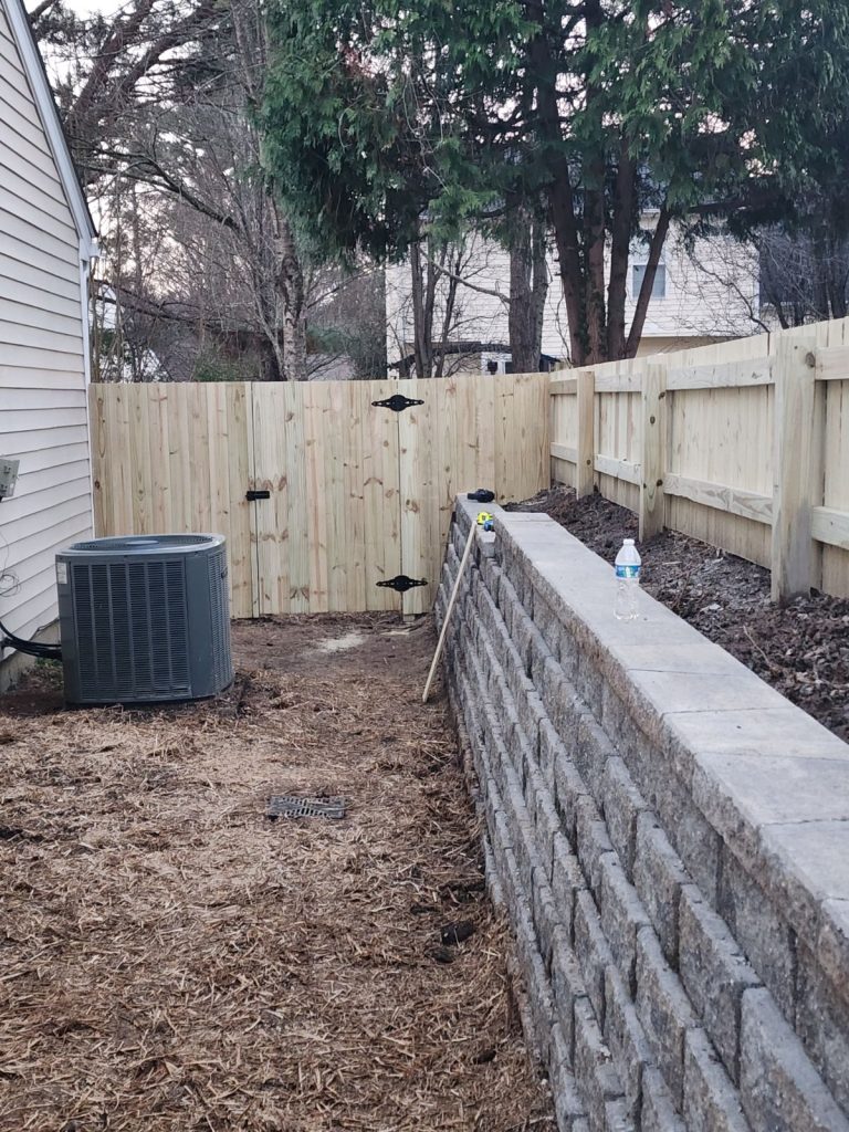 large retaining wall wood fence